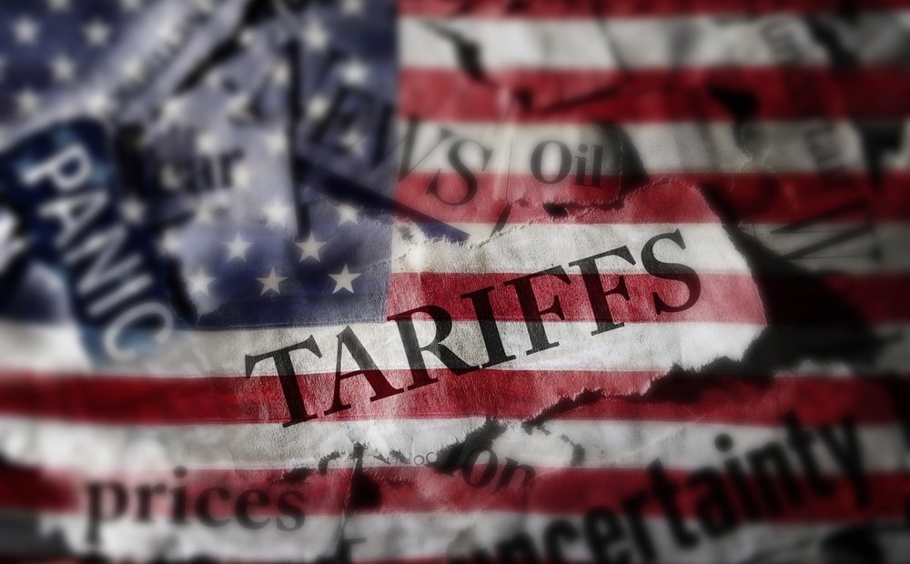 Tariffs news headlines over an American flag