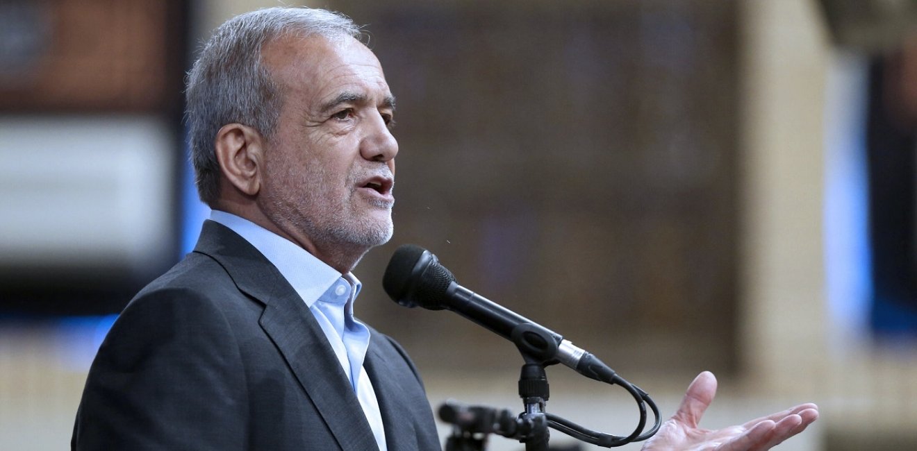 Iranian President Masoud Pezeshkian at podium