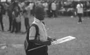 Young Nigerian boy holding a campaign sign.