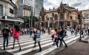 People walking across the street in Sao Paulo, Brazil.