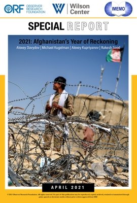 On the cover of the report is a picture of a man in a military uniform standing behind a barbed wire fence.