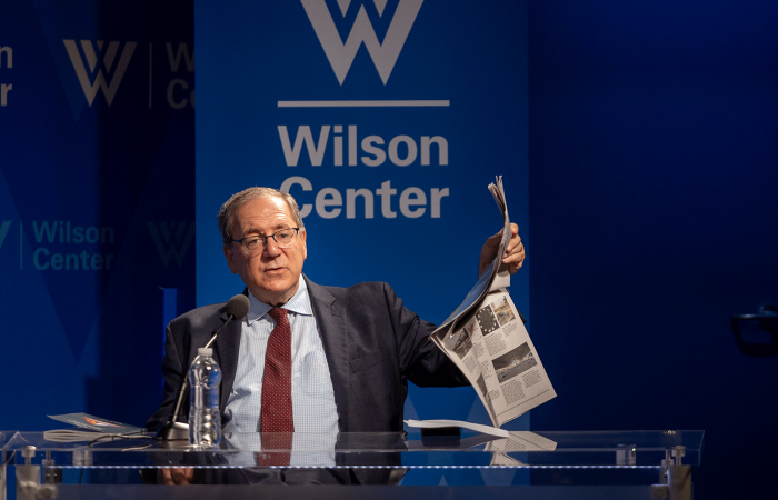 David Sanger holding up a newspaper 