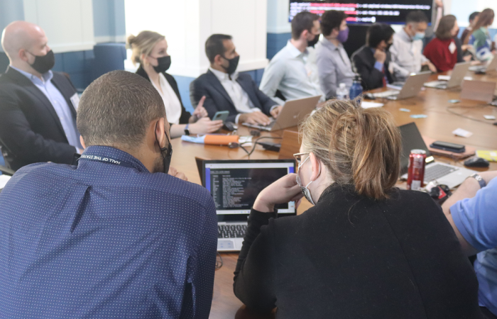 Two tech labs participants sharing a computer screen