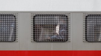 Russian national guard member inside of a riot truck