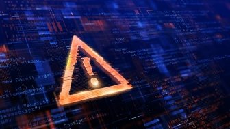 Yellow triangle with an exclamation point in it, in front of a blue glitching coding background