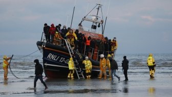 Migrants brought ashore after being rescued at sea by RNLI after travelling across the English Channel.
