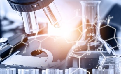 A microscope and a beaker over laid with a chemical makeup of a molecule