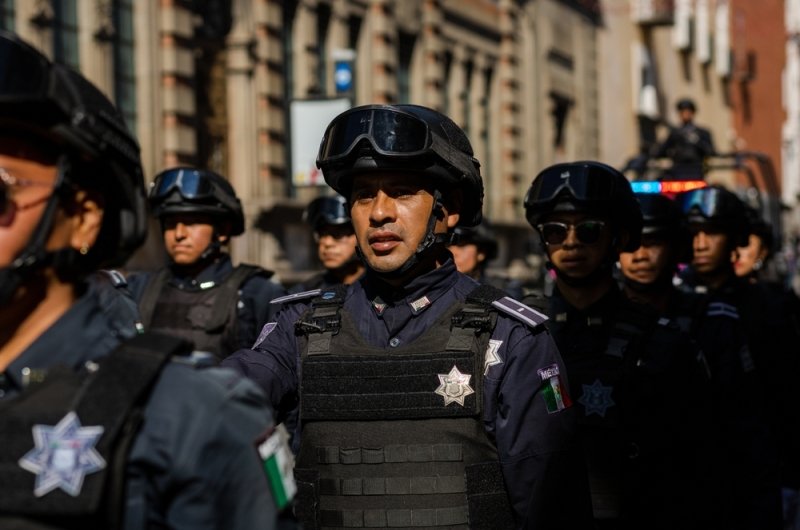 Puebla, Mexico - September 16, 2022: Puebla state police officers walk the streets in a surveillance operation