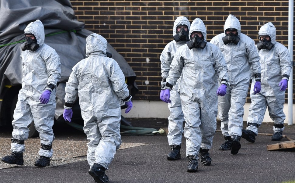 People in hazmat suits clean up the site of the poisoning of Sergei Skripal in Salisbury