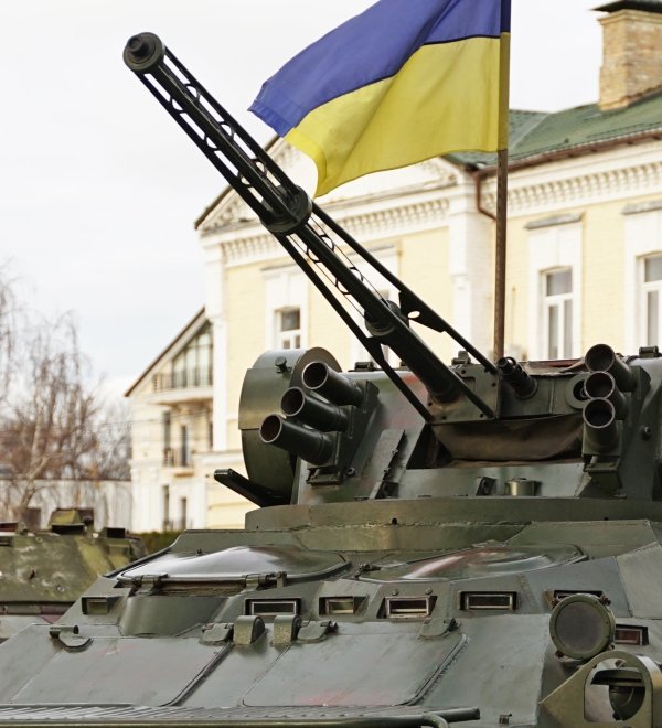 Army troops transporter and tank with Ukrainian flag, Ukraine