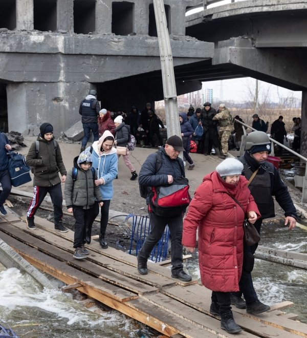 IRPIN, UKRAINE - Mar. 09, 2022: War in Ukraine. Thousands of residents of Irpin have to abandon their homes and evacuate as russian troops are bombing a peaceful city. War refugees in Ukraine