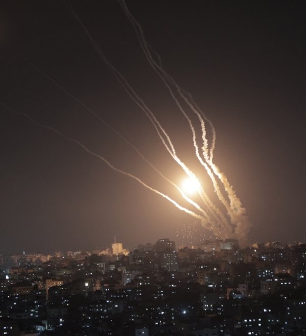 Smoke trails from rockets fired from Gaza at night