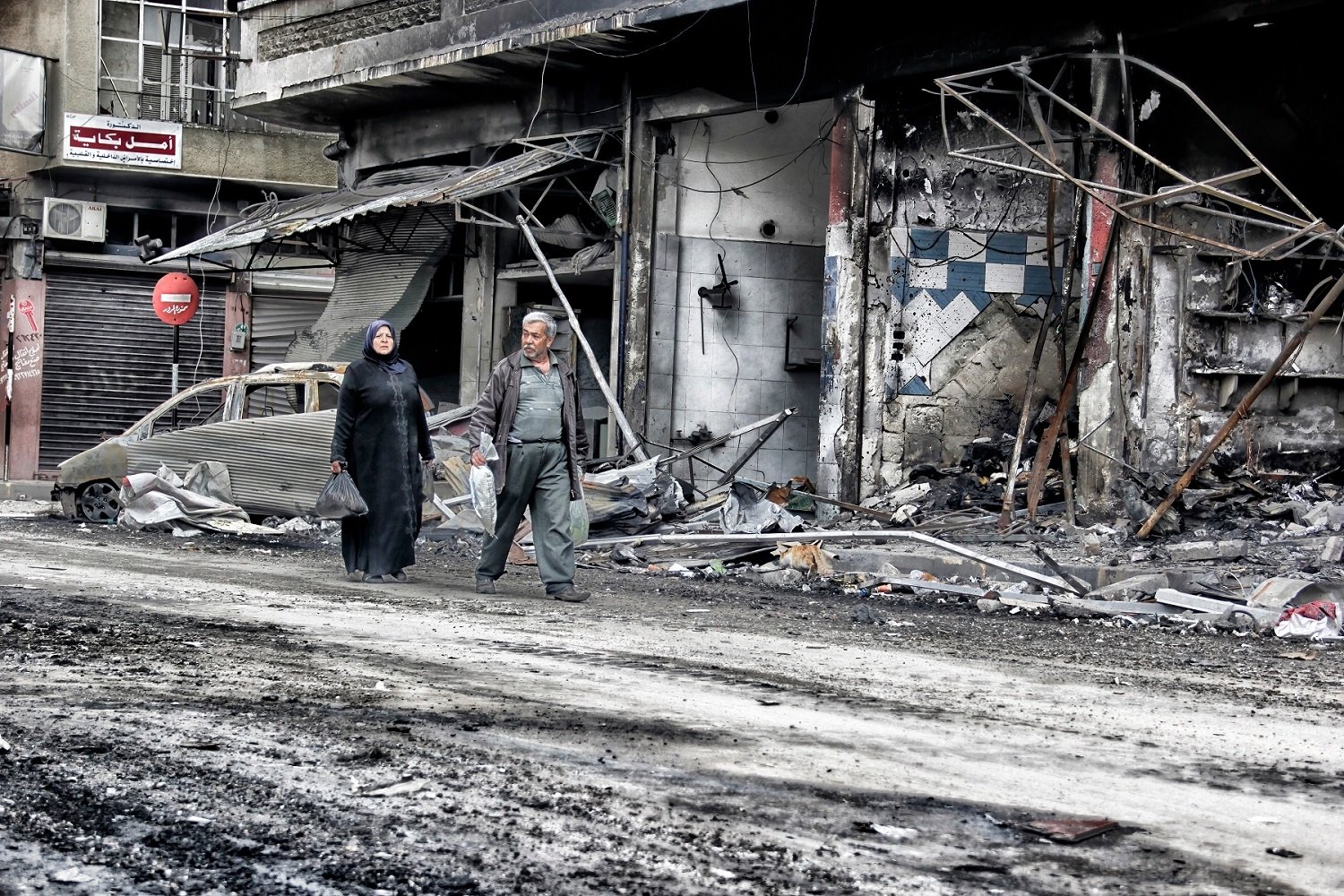 Destroyed buildings along a Syrian street