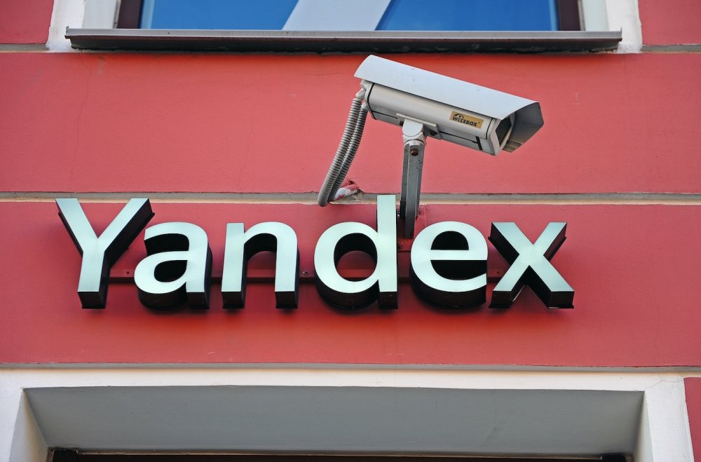 Yandex city store facade and logo accompanied by a surveillance camera