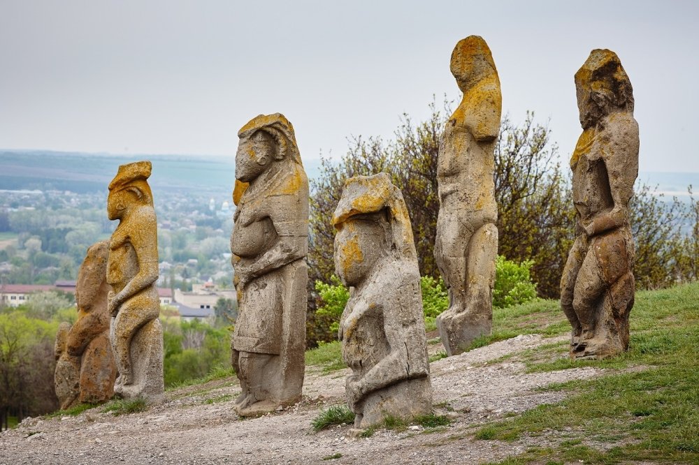 image of ancient statues on a hillside 