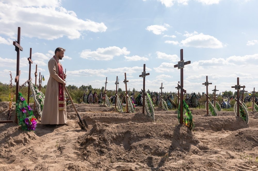 Burial of the remains of 13 unidentified and two identified people who were killed in the Bucha district during the Russian occupation