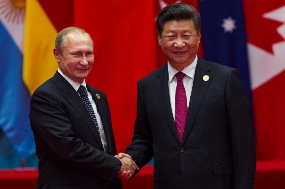 HANGZHOU, CHINA - SEPT. 4. 2016 - Chinese president Xi Jinping (R) welcomes Russian President Vladimir Putin (L) in G20 summit in Hangzhou.