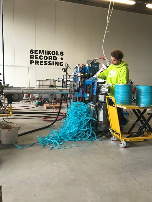 Man working a record press