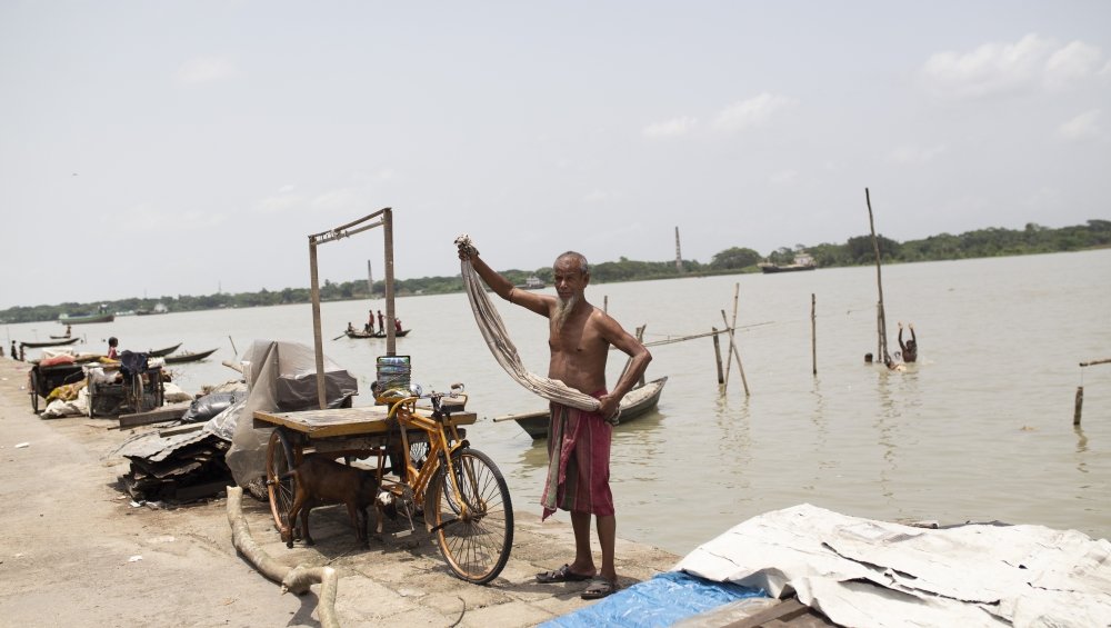 Village ringed with concrete embankments to slow erosion 