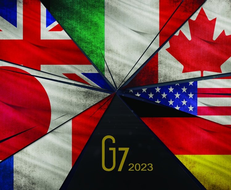 A picture of the seven flags of the G7 countries on fracturing glass shards.