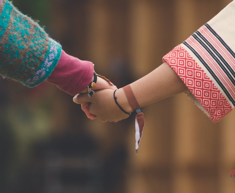 Norwegian and Taiwanese Indigenous youth holding hands