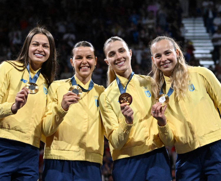 Gold medalists Olena Kravatska, Alina Komashchuk, Olga Kharlan and Yuliya Bakastova during the victory ceremony for the women's team sabre event at the Grand Palais during the 2024 Summer Olympics.