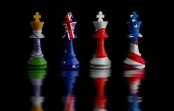 Four chess rooks with the flags of India, Australia, Japan, and the United States imprinted on them.