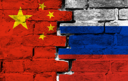 Brick wall with the flags of Russia and China