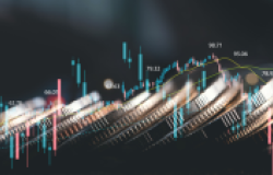 Financial chart trending upward with coins in the background