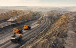 Dump trucks leaving a quarry