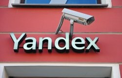 Yandex city store facade and logo accompanied by a surveillance camera