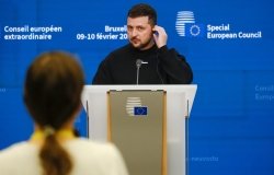 Zelenskyy on a podium at an event 