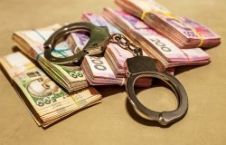 Iimage of Ukrainian hryvnia and handcuffs